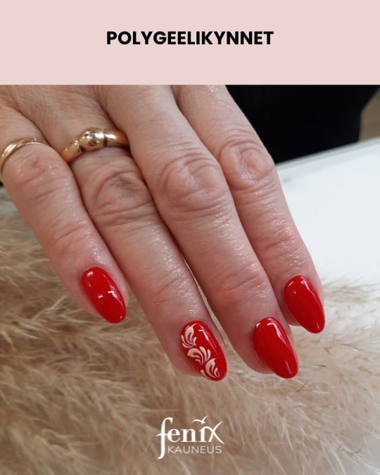 Punaiset polygeelikynnet valkoisilla lehtikuvioilla.